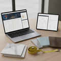 Laptop and tablet with multiple professional tools open simultaneously