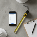 Smartphone with Google Form measurement checklist on job site